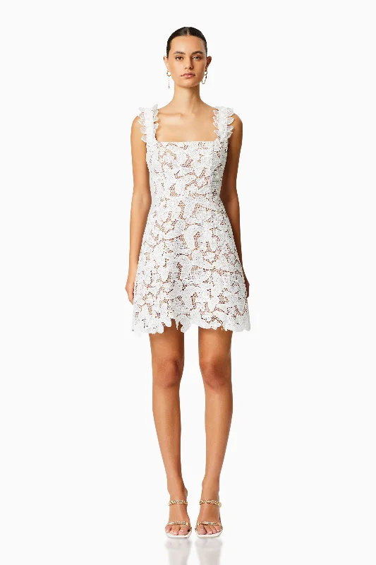 Mini dresses with pom - pom trims for a playful feel Pine Lace Mini Dress In White
