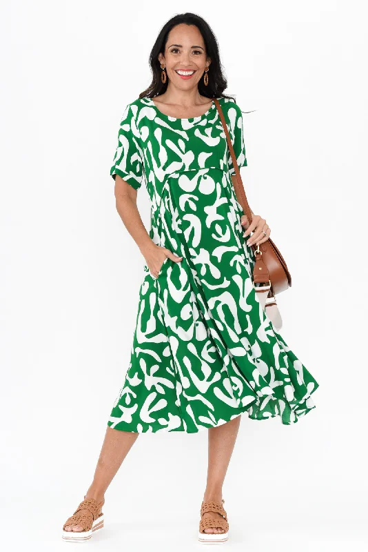 Maxi Women Dress with Floral Print for a Bohemian VibeMaxi Women Dress with Floral Print for a Bohemian VibeZaelia Green Abstract Crescent Dress